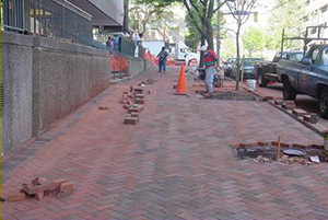 Workers Filling in Sidewalk